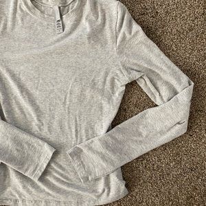 SKIMS grey long sleeve. These are form fitting and extremely flattering.